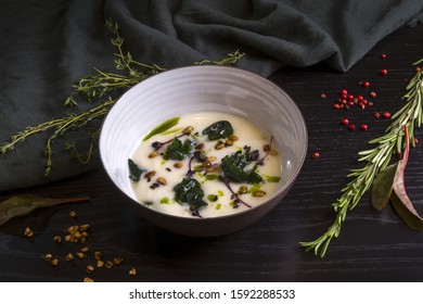 Creamy Cauliflower Soup With Pine Nuts And Herbs.