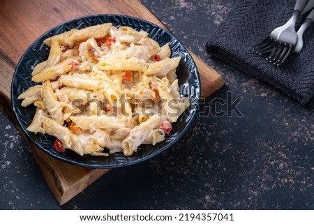 Creamy Chicken Pasta Bowl. With copy space bottom right.