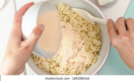 Creamy Delicious Macaroni And Cheese Close Up In A Bowl, View From Above, Woman Hands