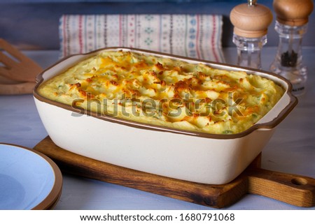 Creamy fish pie: salmon, cod, smoked coley, creamy sauce and cheesy potato topping