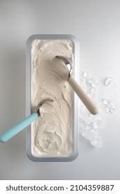 Creamy Ice Cream In A Metal Tray  With A Spoon For Making I've Cream Balls.