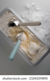 Creamy Ice Cream In A Metal Tray  With A Spoon For Making I've Cream Balls.