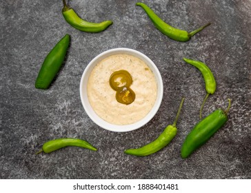 Creamy Jalapeno Sauce With Sour Cream, Mayonnaise, Buttermilk, Jalapeno Pickle, Coriander, Dried Parsley, Onion Powder, Lemon Juice, Garlic Powder, Salt And Hot Red Pepper On Black Background