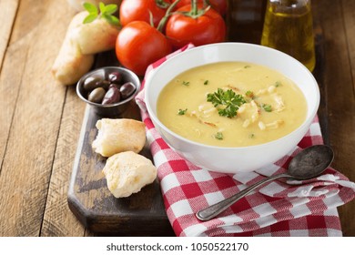 Creamy Lemon Chicken Soup With Rice Garnished With Parsley