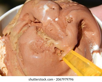 Creamy melting chocolate and caramel ice cream in closeup