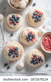 Creamy Mini Pavlova Made Of Fresh Berries And Mascarpone On Baking Paper