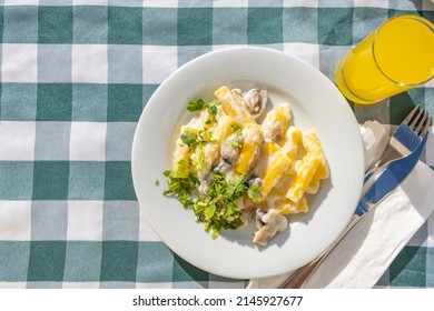 Creamy Mushroom Pasta On White Plate.