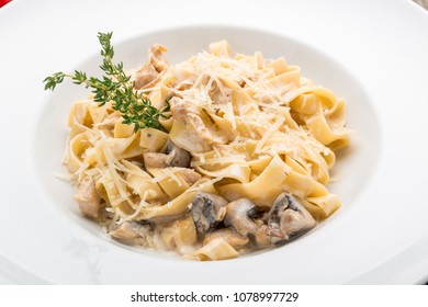 Creamy Mushroom Spinach Pasta. Toning. Selective Focus, On A Wooden Table