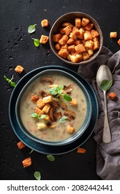 Creamy mushrooms soup with croutons and champignons. Champignons soup made of cream and croutons.