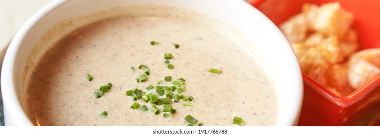 Creamy Onion Soup With Green. Health Food At Cafe. Classic Cuisine. Cooking Bowl With Bread Croutons. Yam Dish. Hot Vegetable Plate. Horizontal Banner. Copyspace