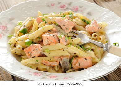 Creamy Pasta With Salmon And Parsley In White Plate