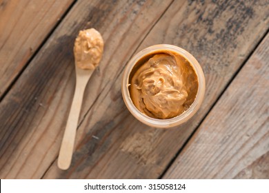Creamy Peanut Butter in jar. Top view.