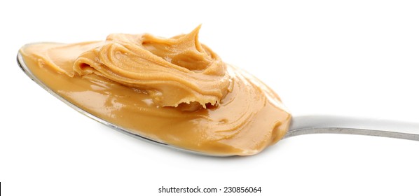 Creamy Peanut Butter In Spoon, Isolated On White