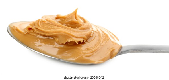 Creamy Peanut Butter In Spoon, Isolated On White