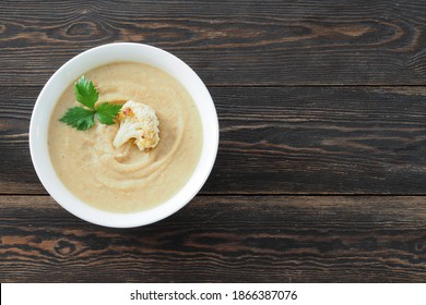 Creamy Roasted Cauliflower Soup On Rustic Table