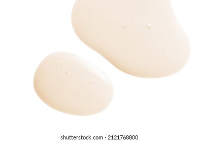 Creamy serum texture. Soft yellow skincare liquid drops. Cosmetic emulsion swatch isolated on white background
