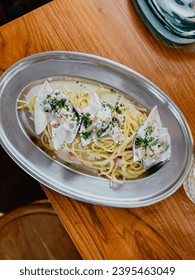 Creamy spaghetti in Indie restaurant - Shutterstock ID 2395463049
