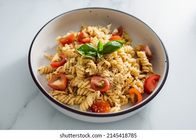 Creamy Vegan Garlic Fusilli Pasta With Cherry Tomatoes And Basil Topping, Healthy Plant-based Food Recipes