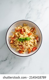 Creamy Vegan Garlic Fusilli Pasta With Cherry Tomatoes And Basil Topping, Healthy Plant-based Food Recipes