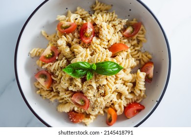 Creamy Vegan Garlic Fusilli Pasta With Cherry Tomatoes And Basil Topping, Healthy Plant-based Food Recipes