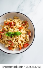 Creamy Vegan Garlic Fusilli Pasta With Cherry Tomatoes And Basil Topping, Healthy Plant-based Food Recipes