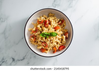 Creamy Vegan Garlic Fusilli Pasta With Cherry Tomatoes And Basil Topping, Healthy Plant-based Food Recipes