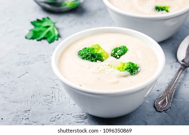 Creamy White Bean Broccoli Soup Puree In A Bowl On Blue Concrete Background. Selective Focus, Space For Text. 