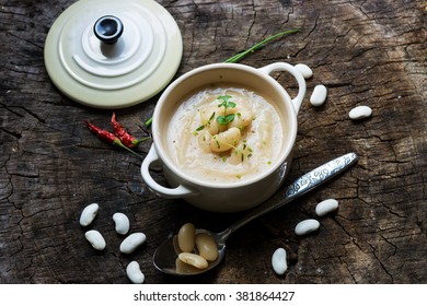 Creamy White Bean Soup On Wooden Background