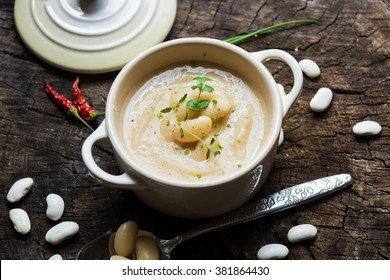 Creamy White Bean Soup On Wooden Background