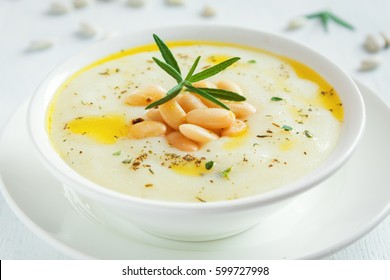 Creamy White Bean And Vegetable Soup With Rosemary In White Bowl  - Healthy Homemade Diet Vegetarian Vegan Soup Meal Food