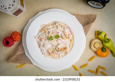 Creamy White Dipped Pasta In A Plate Top View On Wooden Background