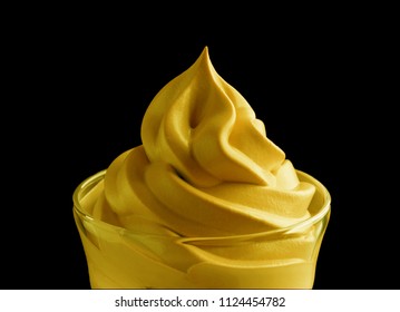 Creamy Yellow Lemon Mango Icecream Soft Serve In Glass Isolated On Black.  Macro. 