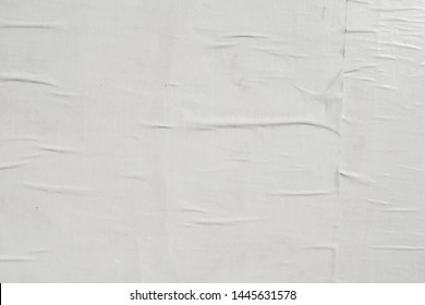 creased crumpled wrinkled glued plastered weathered textured minimal empty white street poster paper background