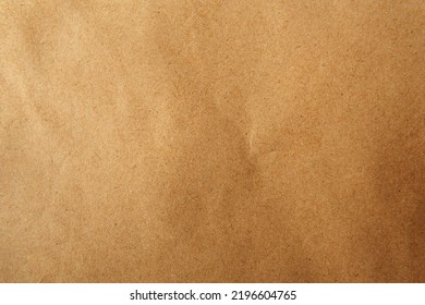 Creased Recyclable And Reusable Wrap Natural Light Brown Or Beige Tone Color With Blank Kraft Paper Sandy Texture Background To Be Use For Website Page Or Environmental Friendly Packaging