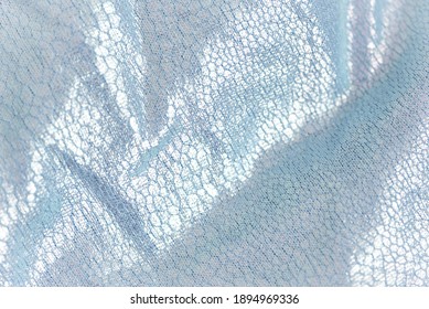Creased textile texture  background template  Shine fabric light blue drapery  Sheene sharkskin fabrics for fashion dress  Shiny fashion clothing material sample  