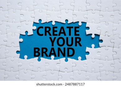 Create your Brand symbol. Concept words Create your Brand on white puzzle. Beautiful blue background. Business and Create your Brand concept. Copy space. - Powered by Shutterstock