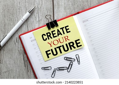 Create your future. text on yellow sticky note on open notepad
