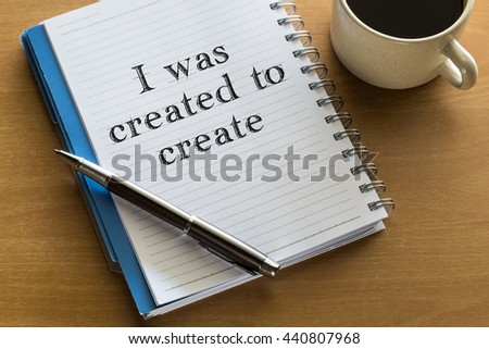  I was created to create positive affirmation note - handwriting on a notebook with cup of coffee