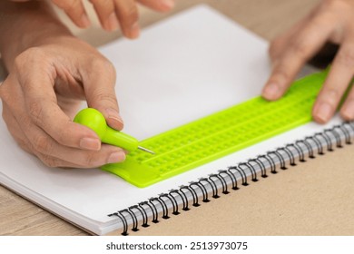 Creating Braille for visually impaired individuals involves carefully crafting raised dots that form tactile symbols, enabling them to read and access information independently. - Powered by Shutterstock