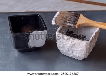 Creating craft flower pot that imitates natural stone. Styling simple cheap ceramic flower pot to look like natural stone