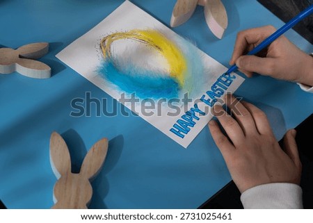 Creating Easter egg with cotton rope and colorful feather Storytelling of creating craft Easter greeting card holiday present. Tactile hand-on activity. Master class progress of creative me-made gifts