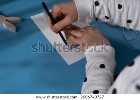 Creating Easter rabbit bunny with cotton rope Storytelling of creating craft Easter greeting card holiday present. Tactile hand-on activity. Master class progress of creative me-made gifts. Seasonal