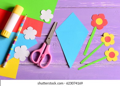 Creating Paper Crafts For Mother's Day Or Birthday. Step. Guide. Details To Making A Paper Bouquet For Mommy. Scissors, Glue Stick, Flowers Templates, Pencil On A Table. Kids Art Activity. Top View