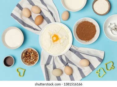 Creating a recipe, Top view of the basic baking ingredients on the blue table, cooking concept