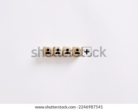 Creating a successful team. Vacant job position. Search for new employees. Hiring, staffing and employment. Personnel management. Leadership position. Wooden cubes with employee symbols and plus sign.