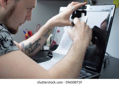 Creating a tattoo close-up. The artist circled the pen with a tattoo sketch on the monitor of his laptop. Draw. Write. To create. - Powered by Shutterstock