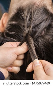 Creation Stage Of Braided Bun. Hairdresser Doing Upside Down French Plait