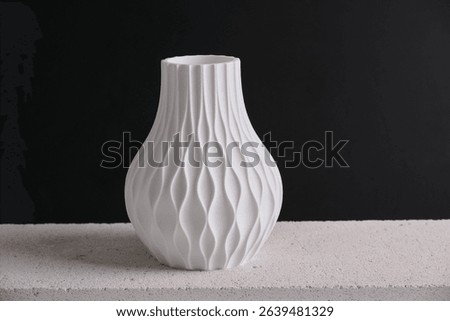 creative 3D technology printed white vase home decor with a flowing geometric texture Decorative Vase For Flowers made from recycled plastic isolated black background