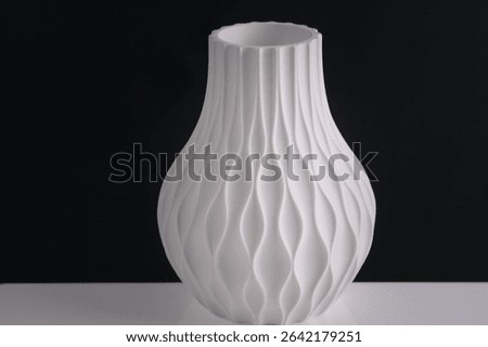 creative 3D technology printed white vase home decor with a flowing geometric texture Decorative Vase For Flowers made from recycled plastic isolated black background