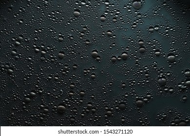 Creative abstract art background. Water drops on gray surface. Bubbled texture effect.